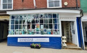 Outside of hungerford bookshop, large frame window, blue wall, door