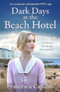 Cover of Dark Days at the beach Hotel. Woman with blonde hair in pink dress on a beach with a hotel in the background. 