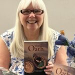 Author patricia osborne pictured with her book, the oath